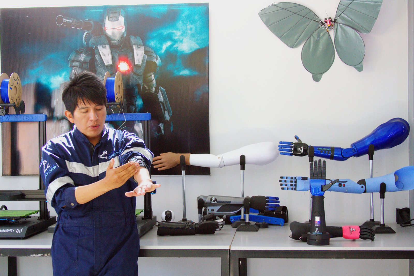 Bolivian robotics developer Roly Ronald Mamani demonstrating a bionic prosthetic arm